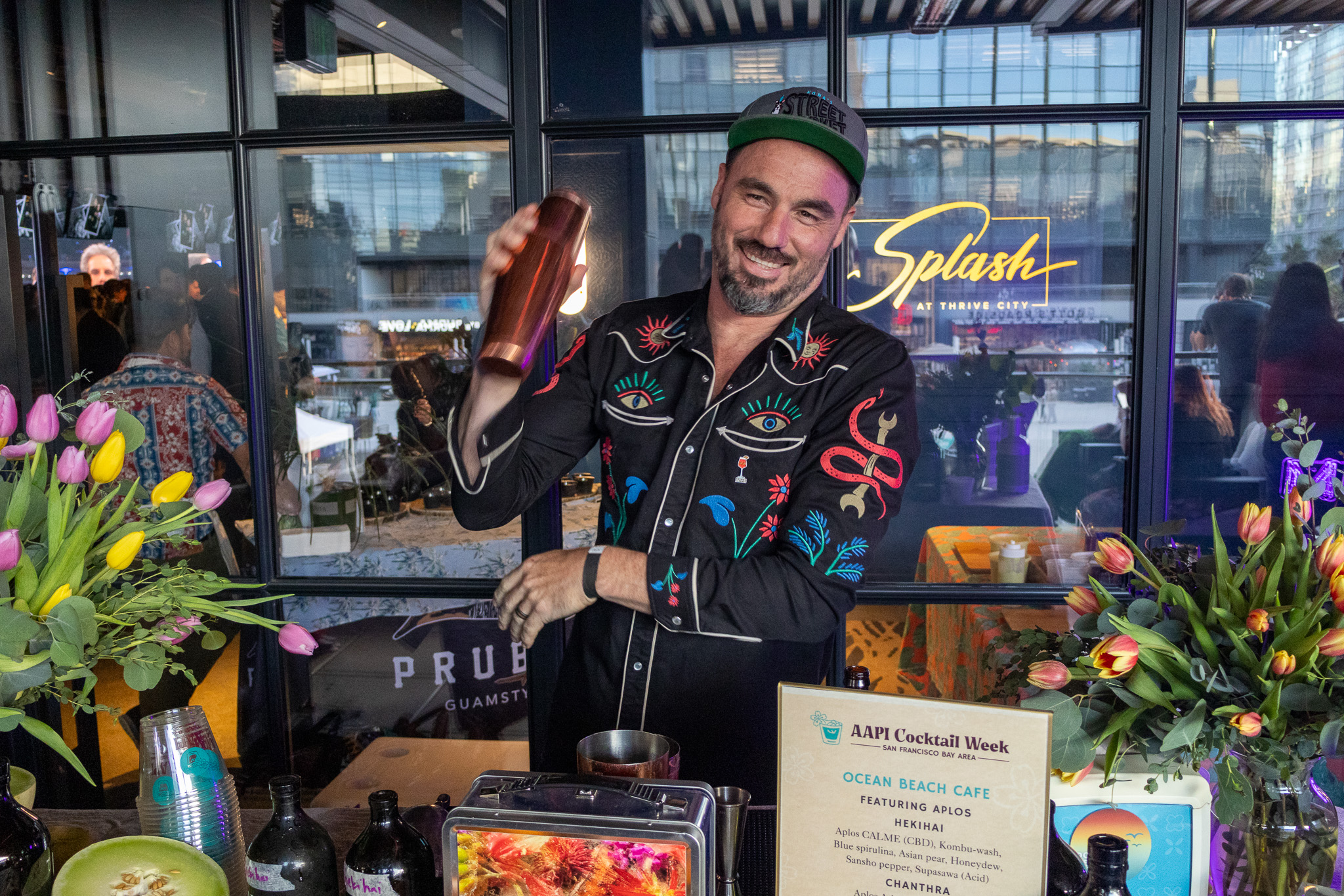 Joshua James, expert bartender shaking a cocktail at a corporate event